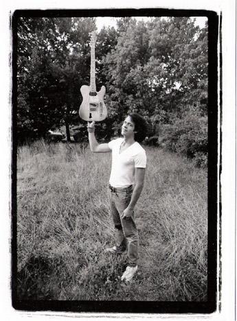 bob holds up guitar.jpg